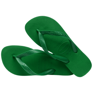 green flip flops with green straps, one shoe leaning on the other shoe left aligned