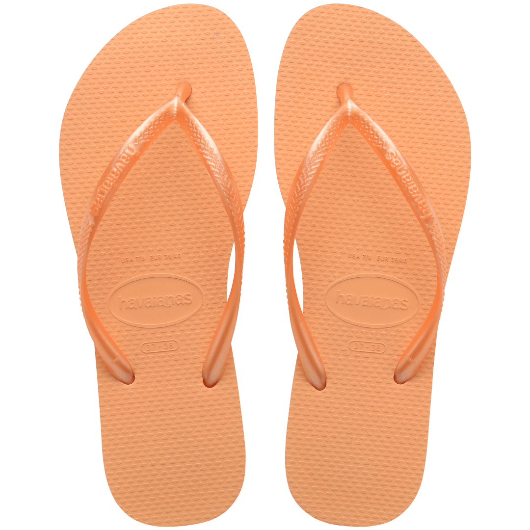 Women's orange flip flops with orange metallic straps, top view