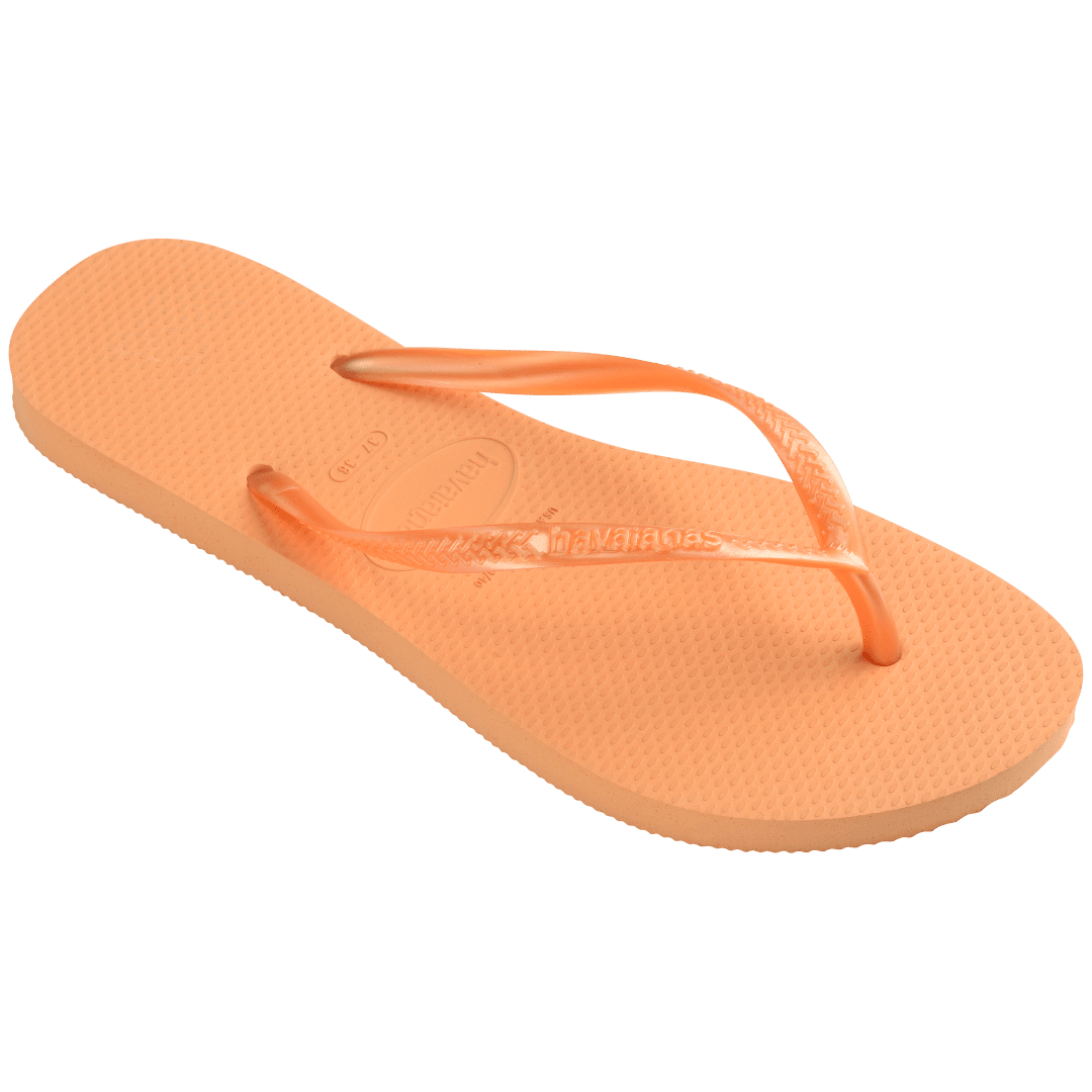 Women's orange flip flops with orange metallic straps, top side angle view