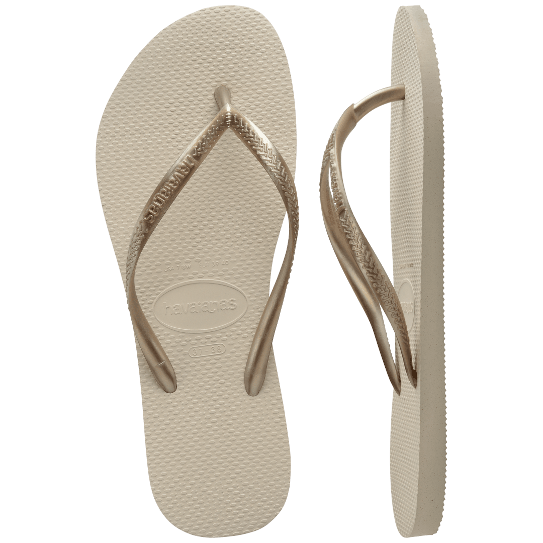 Women's beige flip flops with gold straps, front and side view