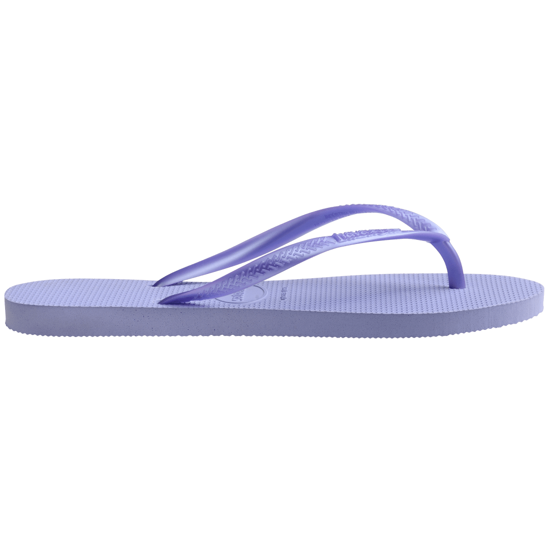 Kids' light purple flip flops with metallic purple straps, side view