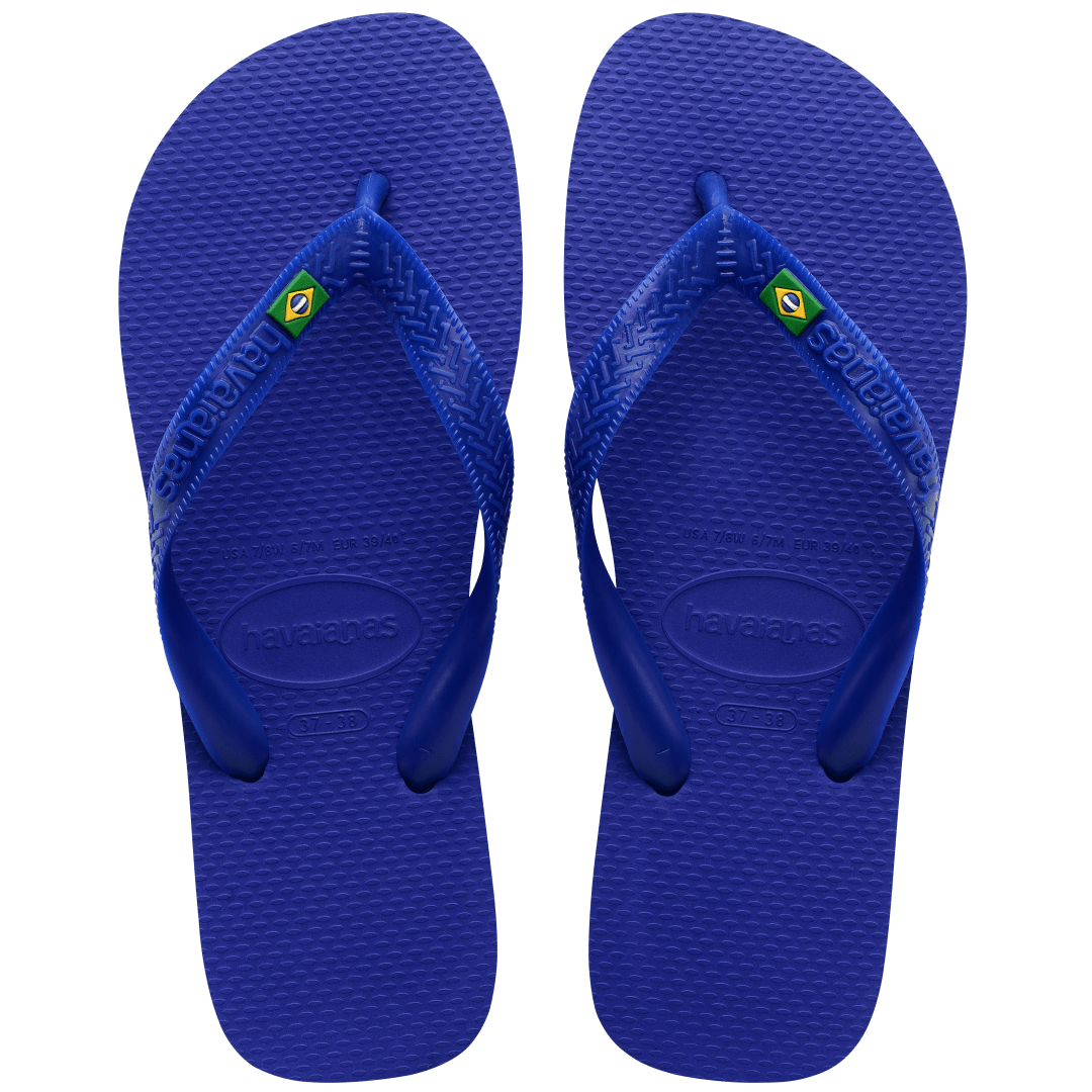 Women's cobalt blue flip flop with Brazil flag detail on the straps, top view