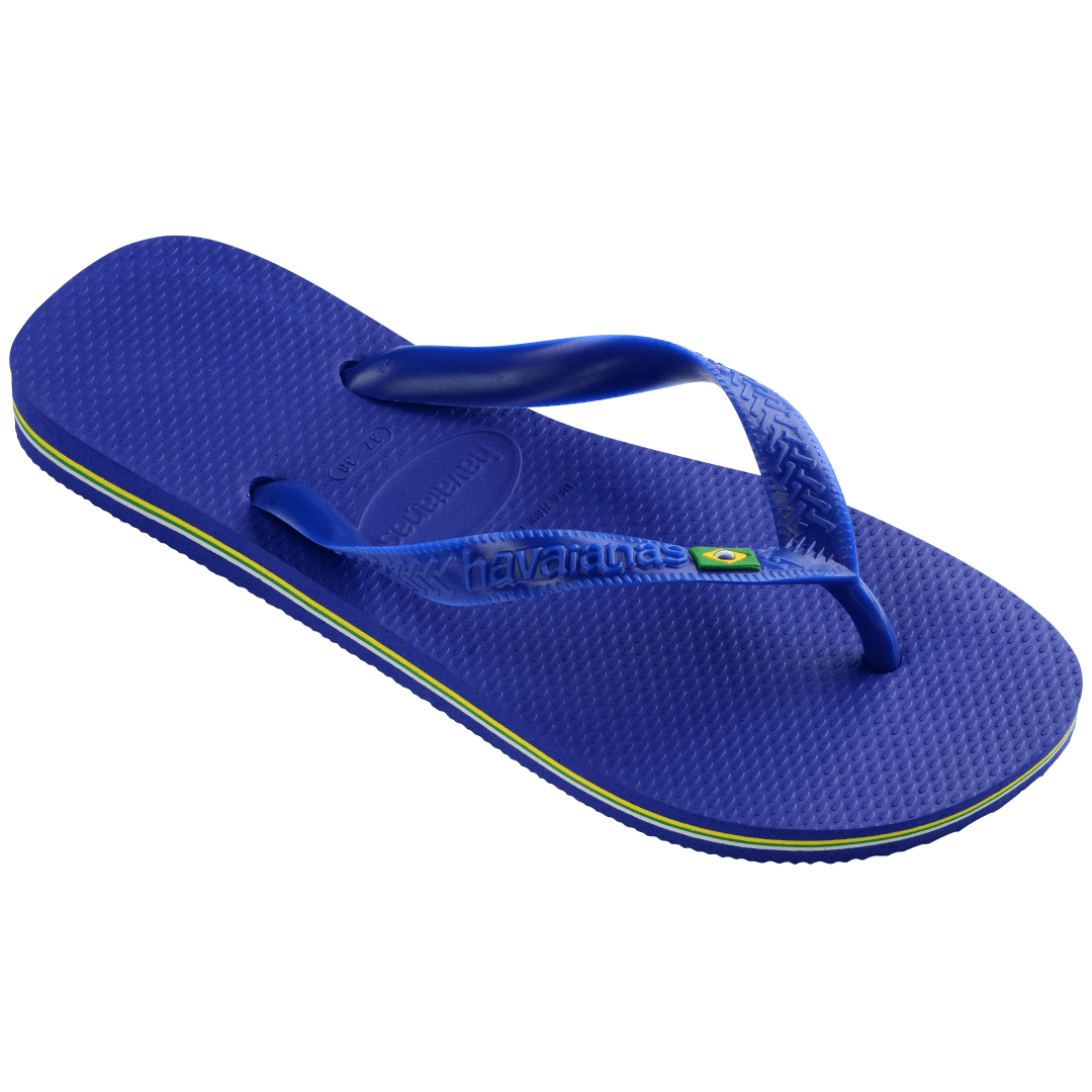 Women's cobalt blue flip flop with Brazil flag detail on the straps, right 3/4 view