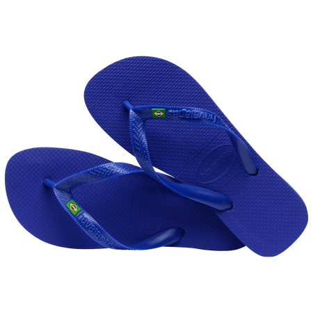 Women's cobalt blue flip flop with Brazil flag detail on the straps, alternate top view