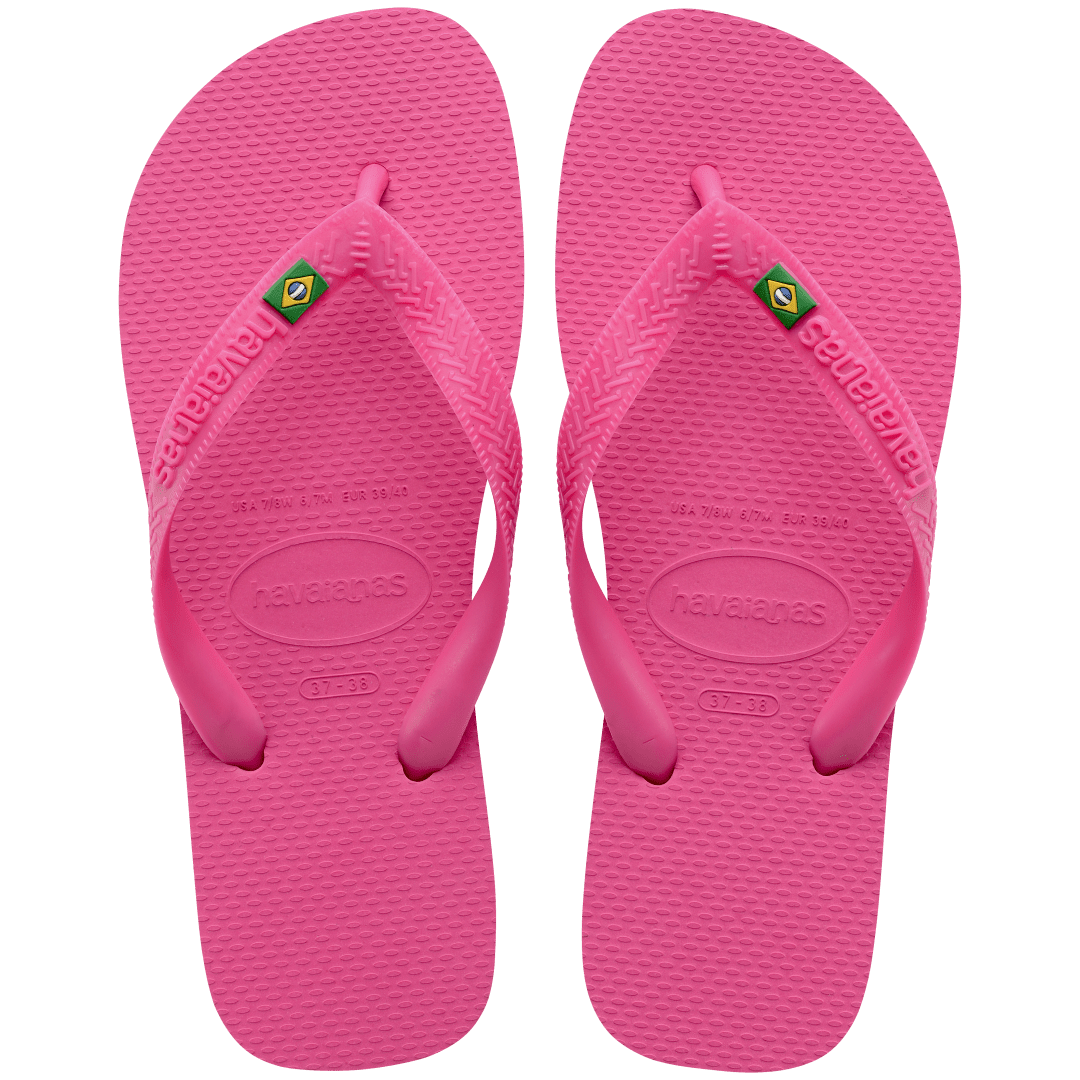 Women's bright pink flip flop with Brazil flag on the straps, top view