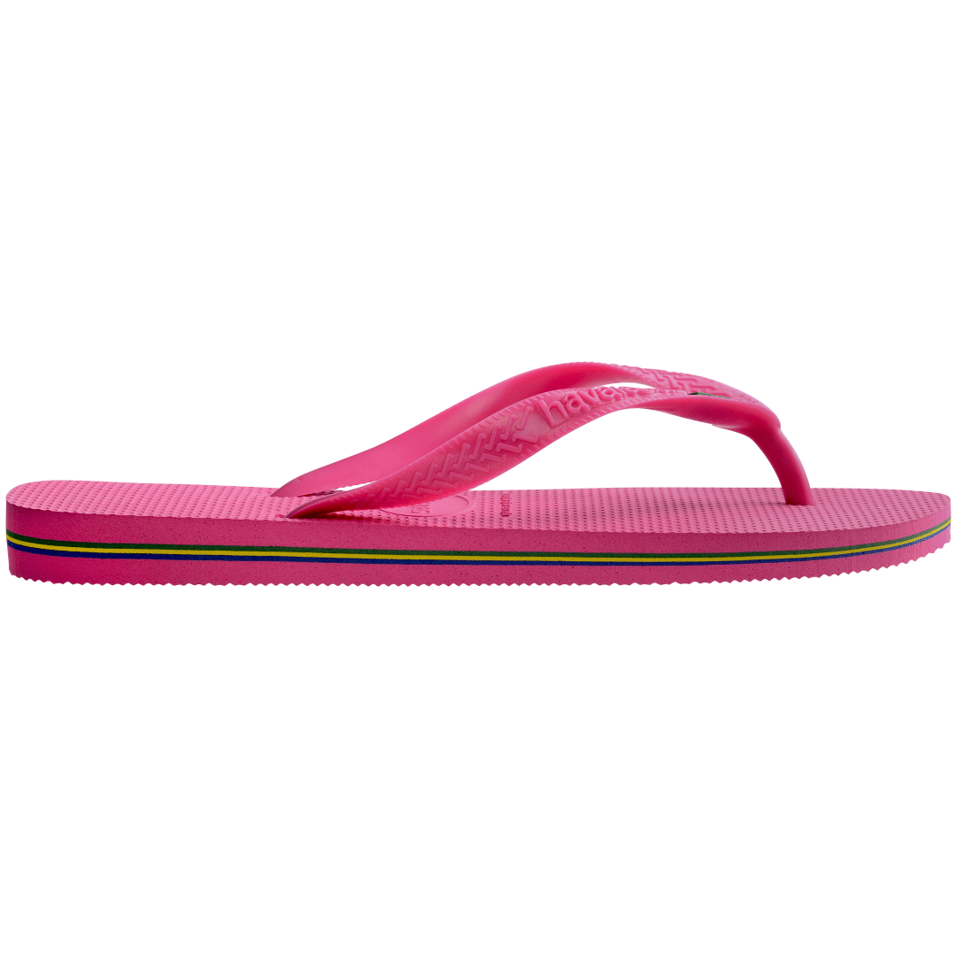 Women's bright pink flip flop with Brazil flag on the straps and contrast stripes in sole, side view