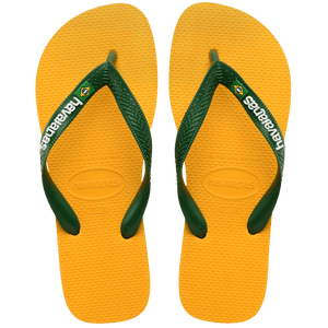 yellow flip flops with green straps featuring a brazil flag, top view