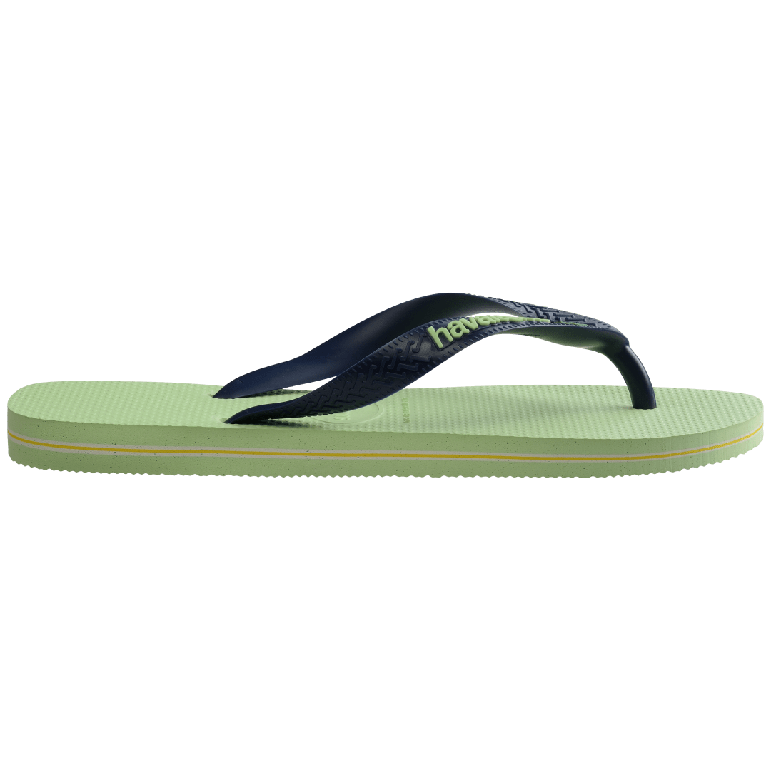 Women's light green flip flop with navy straps featuring Brazil flag detail side view