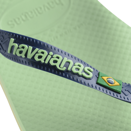 Women's light green flip flop with navy straps featuring Brazil flag detail logo view