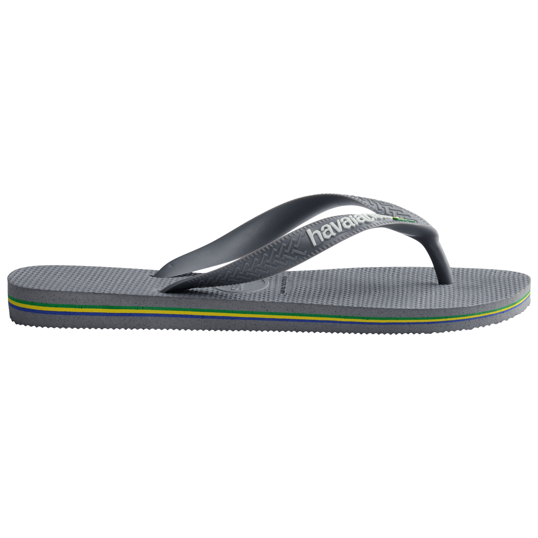 Kids' grey flip flop with Brazil flag detail on the strap, side view