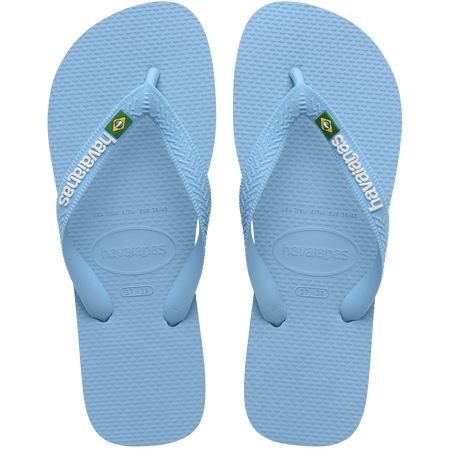 light blue flip flops with a brazil flag on the strap and havaianas written in white, top view