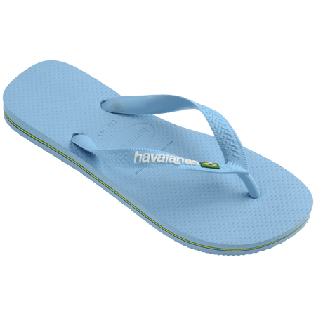 light blue flip flops with a brazil flag on the strap and havaianas written in white, front left view