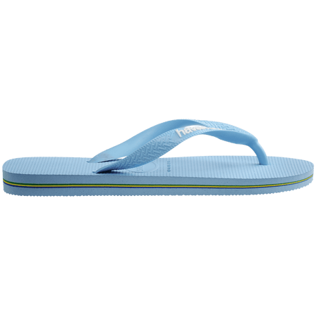 light blue flip flops with a brazil flag on the strap and havaianas written in white, side view