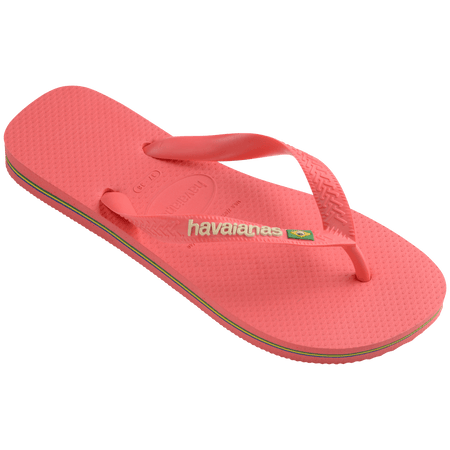 coral pink flip flops with pink straps that feature a small brazil flag, front right view