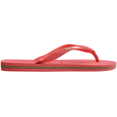 coral pink flip flops with pink straps that feature a small brazil flag, side view