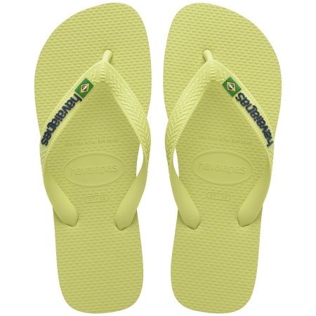 light green flip flops with light green straps, havaianas written in dark green, and a brazil flag top view