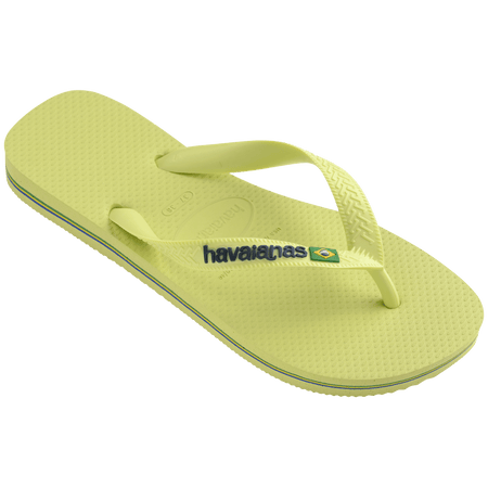 light green flip flops with light green straps, havaianas written in dark green, and a brazil flag front left view