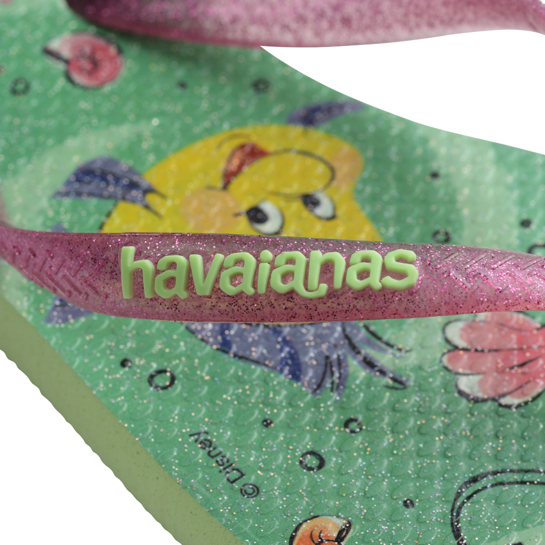 Green Disney's The Little Mermaid flip flops with Ariel and Sebastian and glitter pink straps with green logo detail view