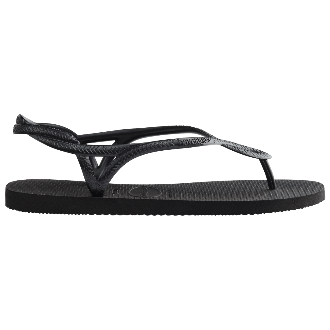 Women's black sandal with figure 8 strap detail, side view