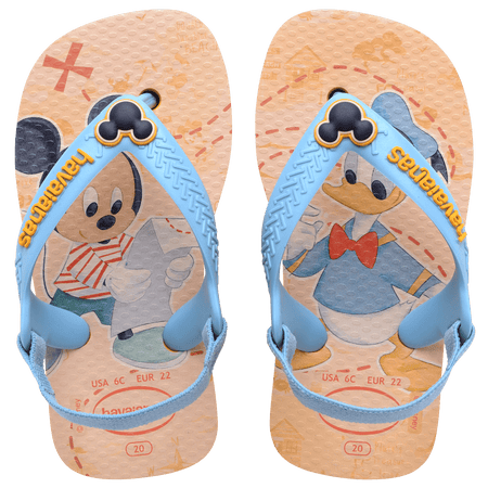 baby sandals with mickey mouse and donald duck on a yellow background with blue straps and a mickey mouse charm, top view