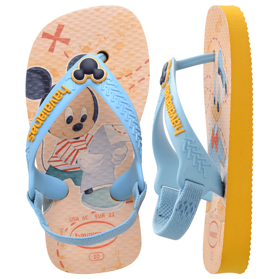 baby sandals with mickey mouse and donald duck on a yellow background with blue straps and a mickey mouse charm, one sandal top view, one sandal on it's side