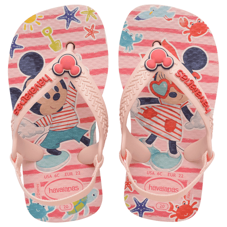 baby sandal with mickey and minnie mouse on pink background with sea creatures and a mickey mouse charm on the pink strap, top view