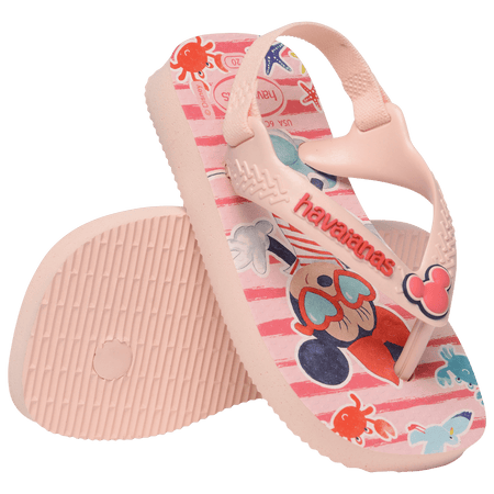 baby sandal with mickey and minnie mouse on pink background with sea creatures and a mickey mouse charm on the pink strap, one sandal leaning on the other, toe facing down