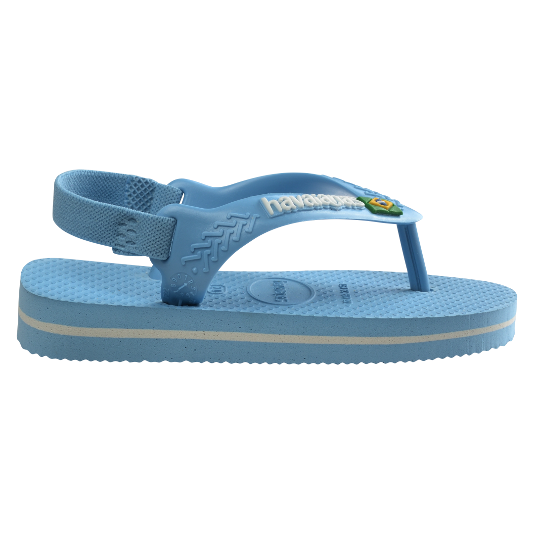 Blue baby flip flops with backstrap and Brazillian flag on strap, side view