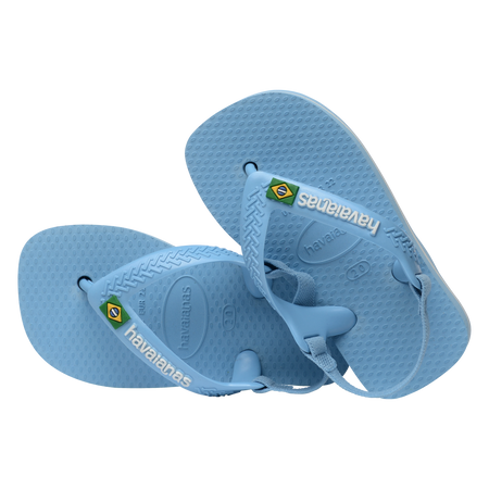 Blue baby flip flops with backstrap and Brazillian flag on strap, both flip flops tilted to the left