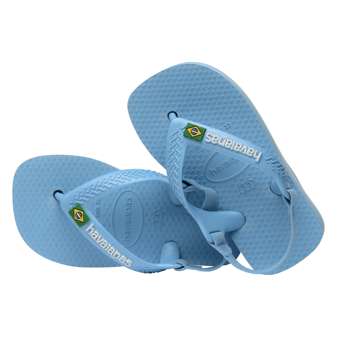 Blue baby flip flops with backstrap and Brazillian flag on strap, both flip flops tilted to the left