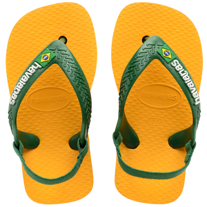 yellow flip flops with green heel straps featuring a brazil flag, top view