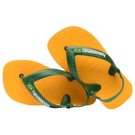 yellow flip flops with green heel straps featuring a brazil flag, one shoe leaning on the other shoe