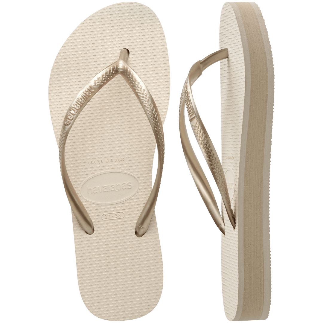 beige platform flip flop, with a darker beige colored midlayer between the sole and bottom of the flip flop, beige metallic straps, one flip flop top view, one side view