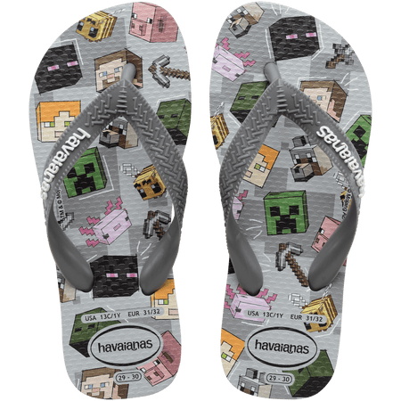 Flip flops with Minecraft blocks on a grey background, mix of green, yellow, pink, blocks and grey straps, top view