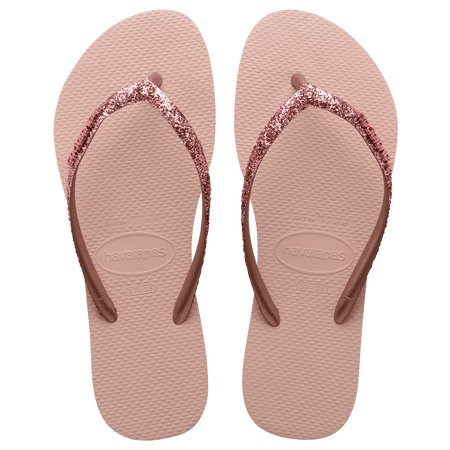 Women's light pink flip flop with pink glitter straps, top view