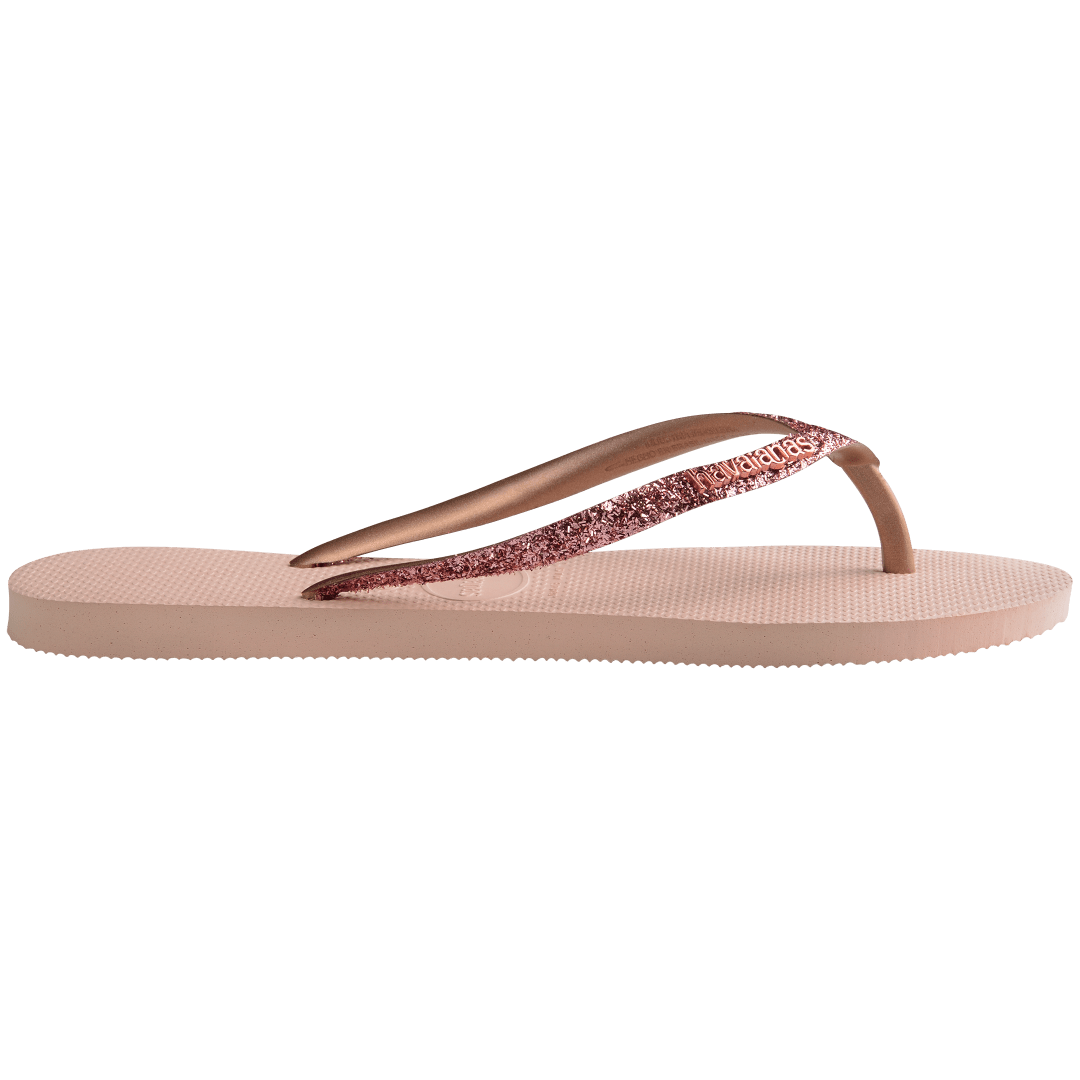 Women's light pink flip flop with pink glitter straps, side view