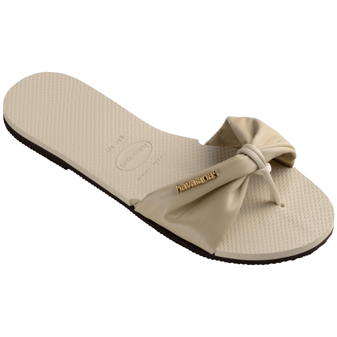 Women's cream sandal with bow detail, 3/4 side view