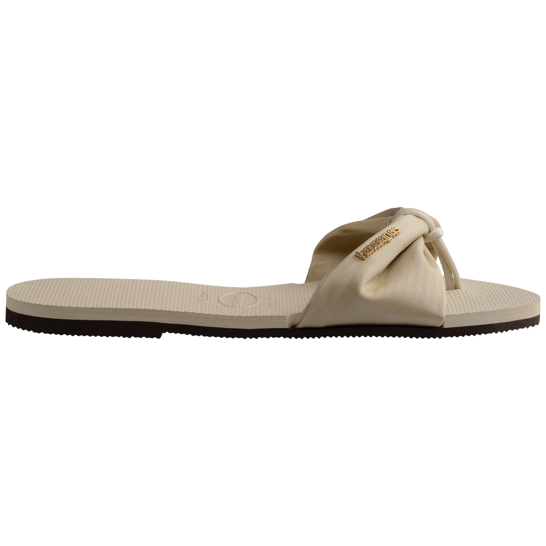 Women's cream sandal with bow detail, side view