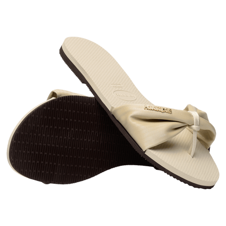 Women's cream sandal with bow detail, sole and top view