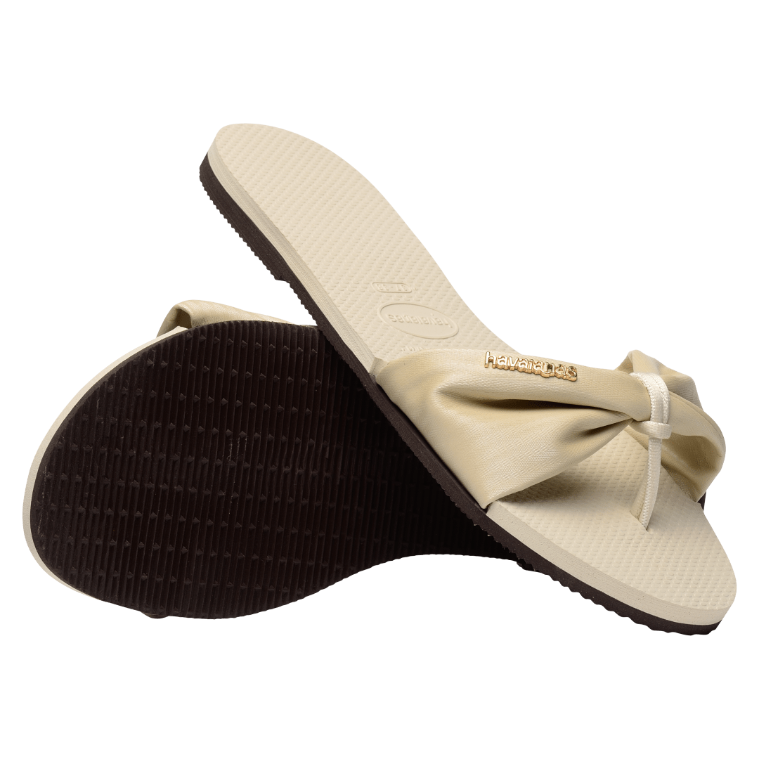 Women's cream sandal with bow detail, sole and top view