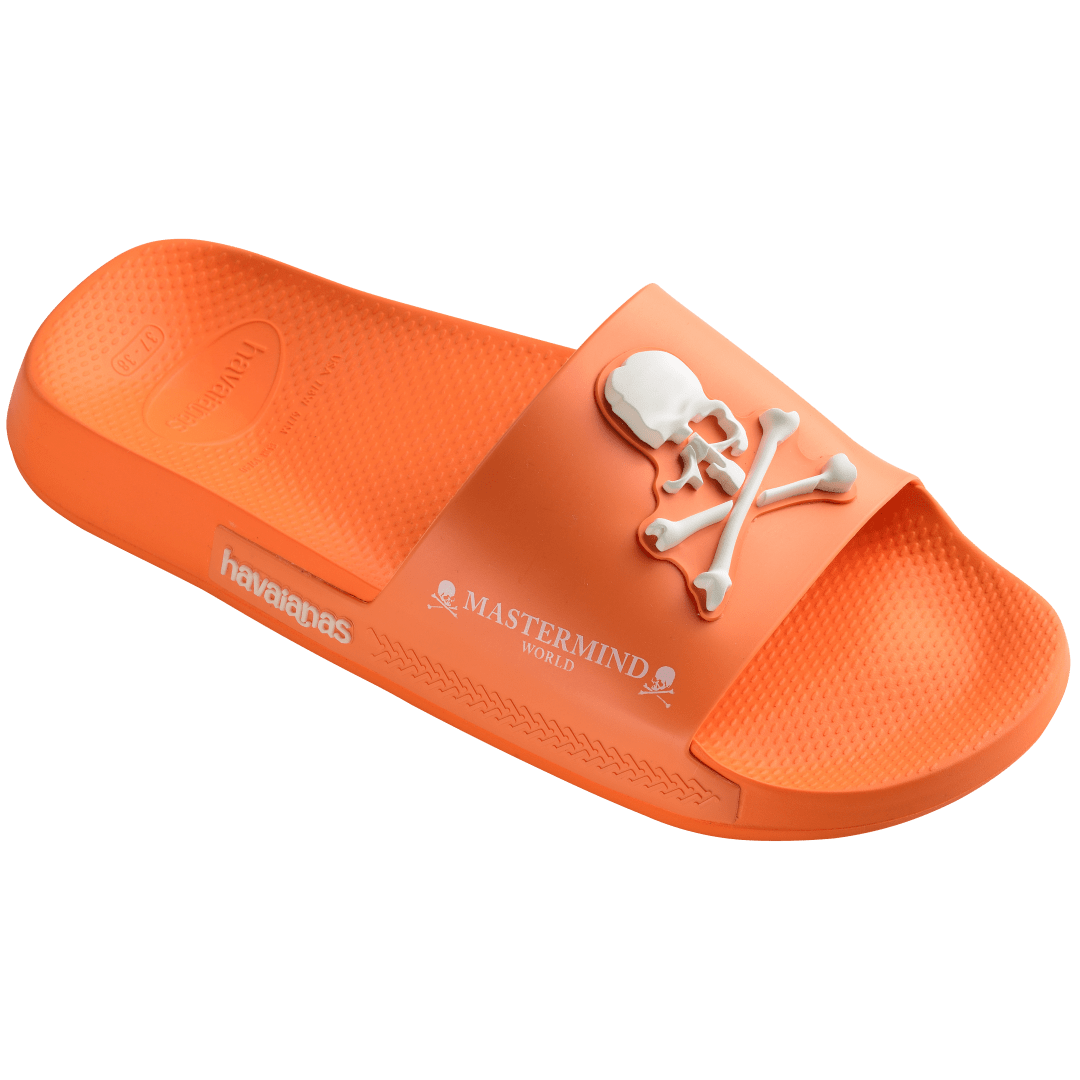 Men's Mastermind orange slides with white skull & cross-bones, 3/4 side view