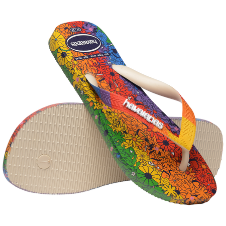 Rainbow floral flip flops with one perched on the other one