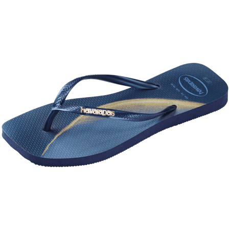 blue and yellow marbled flip flops with blue strap with gold metal havaianas logo, front left view