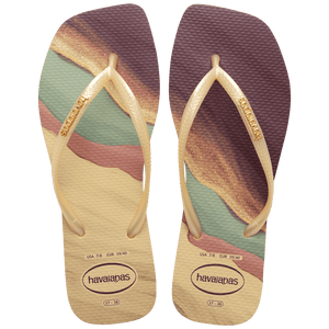 purple, yellow buttercream, teal, and mauve marble patterned flip flops with yellow buttercream straps and gold havaianas logo, top view