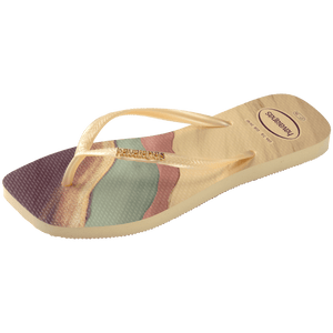 purple, yellow buttercream, teal, and mauve marble patterned flip flops with yellow buttercream straps and gold havaianas logo, side view
