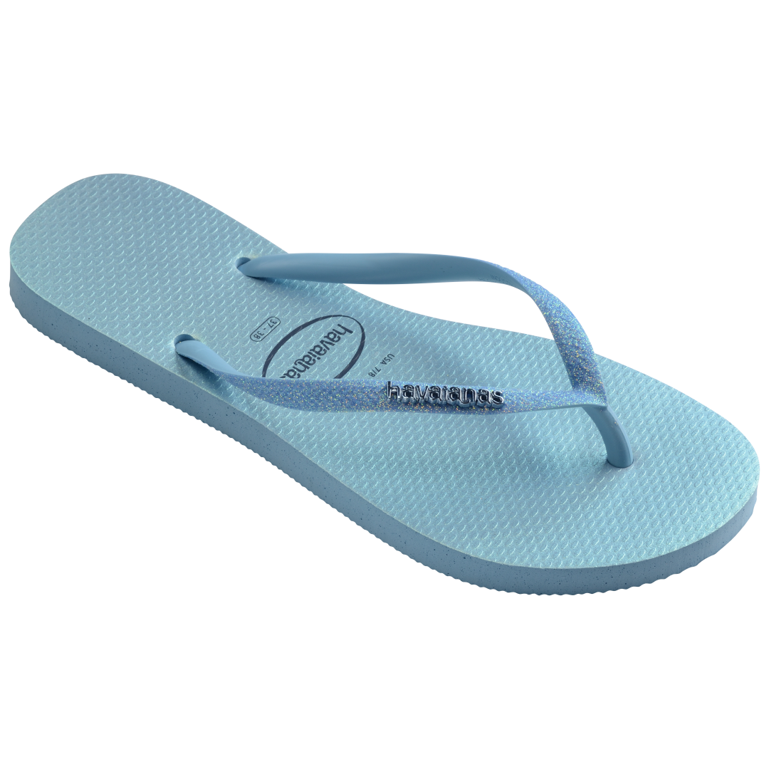 Kids' iridescent blue flip flops with glitter straps 3/4 side view