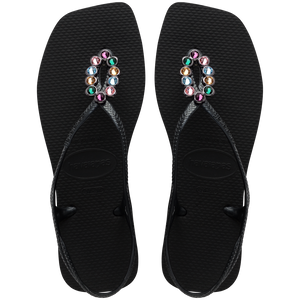 Women's black sandal featuring oval with multicolor crystal details top view