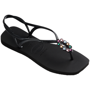 Women's black sandal featuring oval with multicolor crystal details  3/4 side view