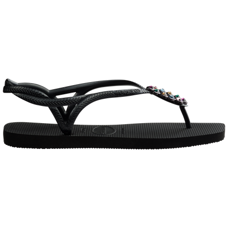 Women's black sandal featuring oval with multicolor crystal details side view