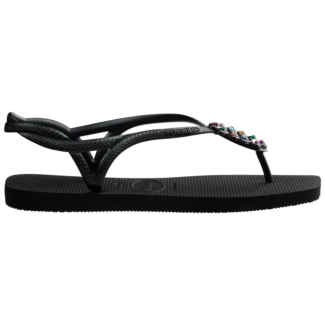 Women's black sandal featuring oval with multicolor crystal details side view